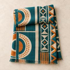 Folded teal geometric African-print scarf